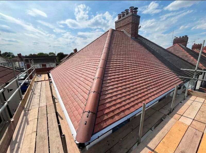 A dry ridge system fitted along the ridge line of a new roof