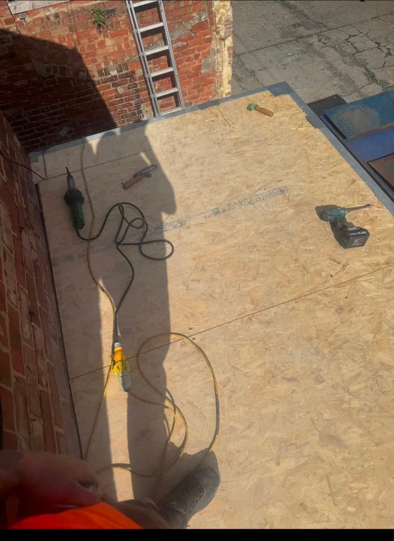 New timber decking fitted to a flat roof ready for the covering