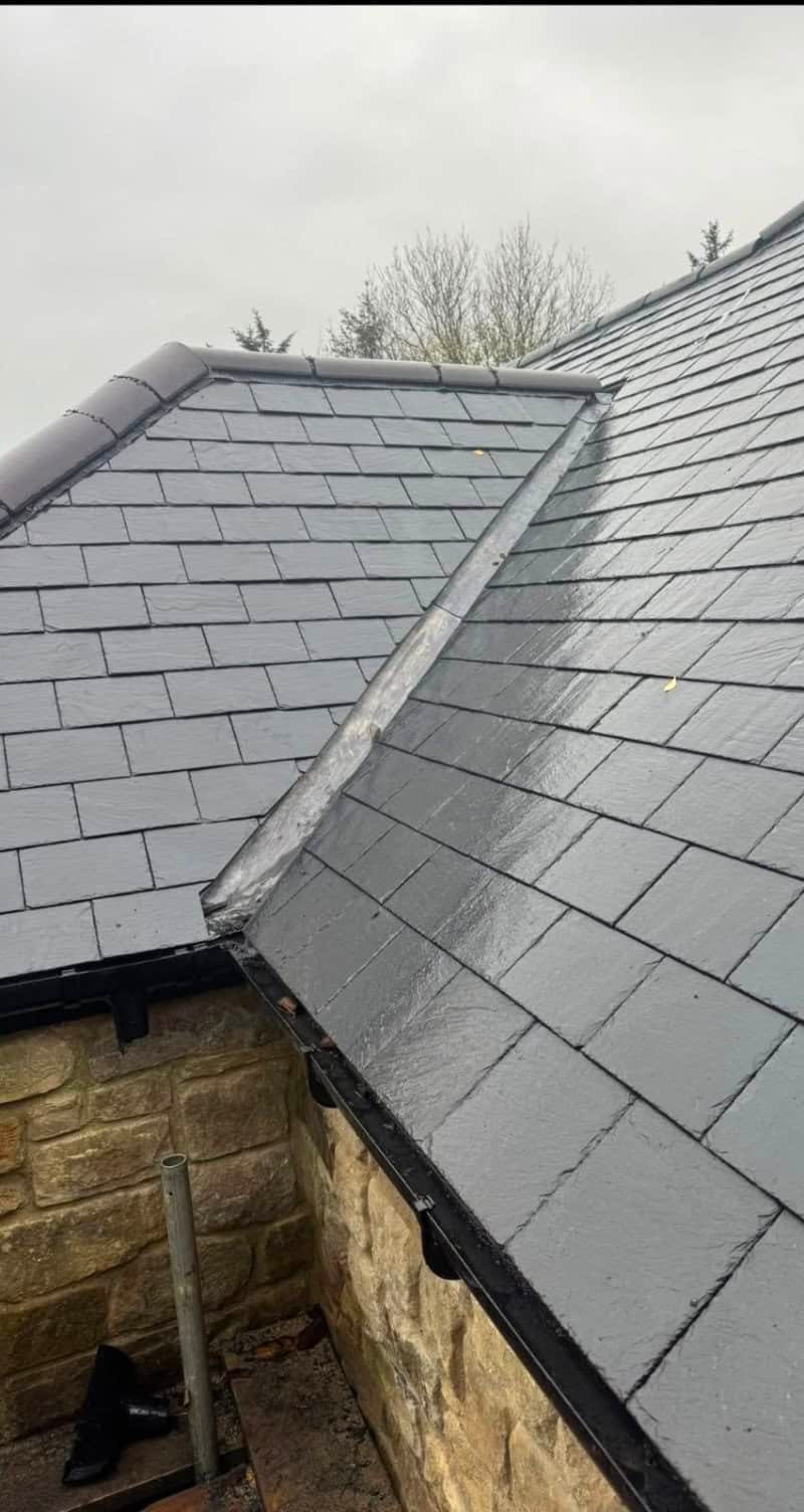 A lead valley channelling water down between two roof slopes